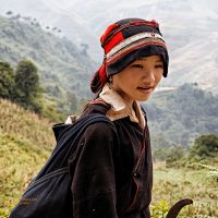 Girl of Dao ethnic group walking on the road